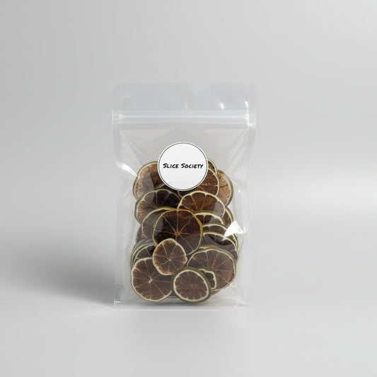 Clear plastic bag with sliced dehydrated limes fruit on a white background with Slice Society logo